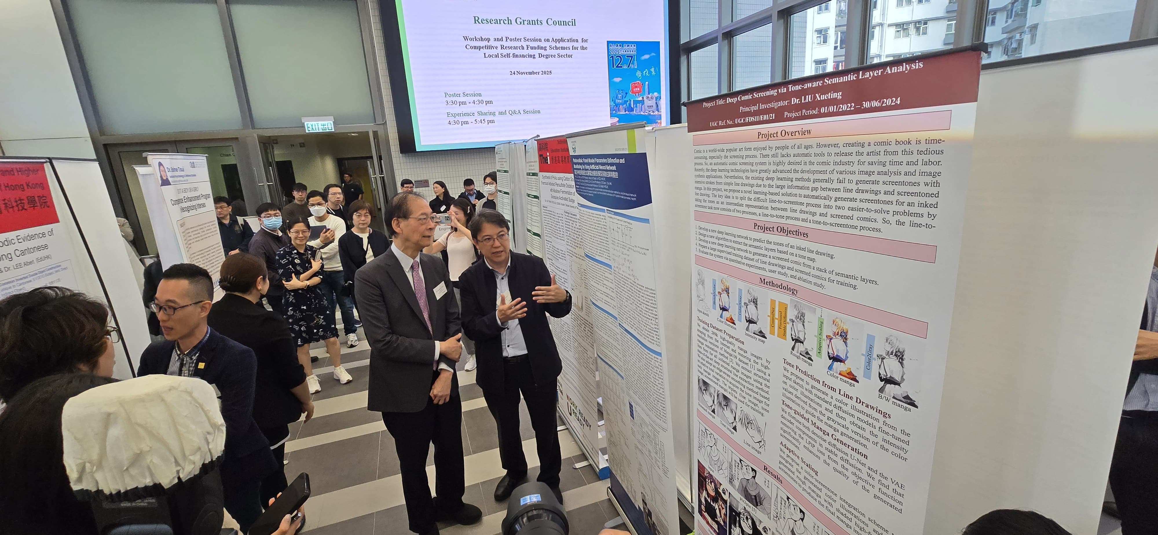 Prof. Tong viewing the research poster