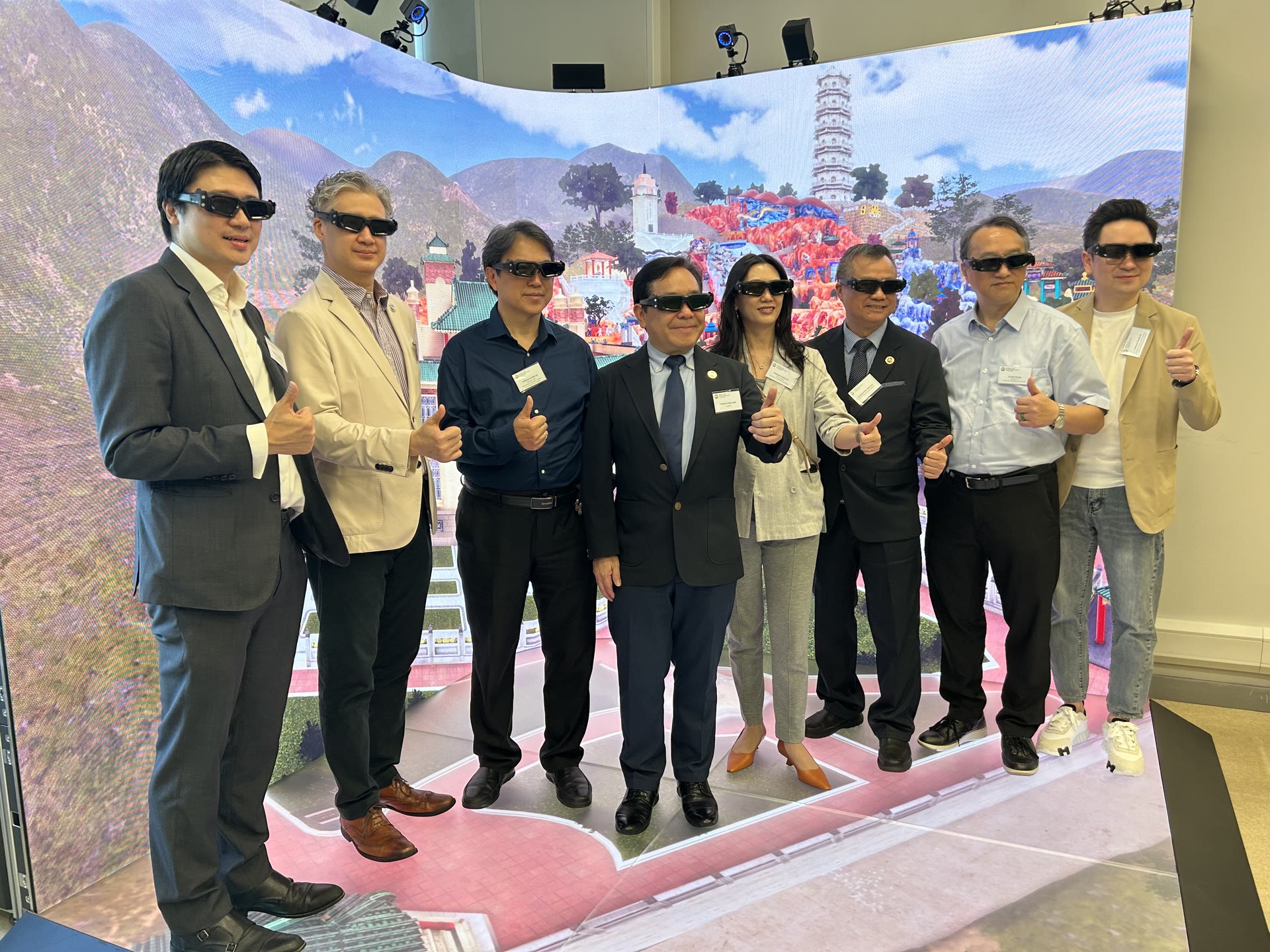 Representatives experiencing the Haw Par Mansion virtual heritage project inside the VR LED CAVE